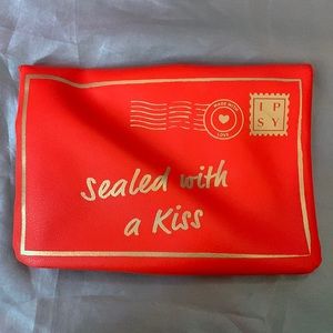 February special red and gold envelope Ipsy makeup bag.
